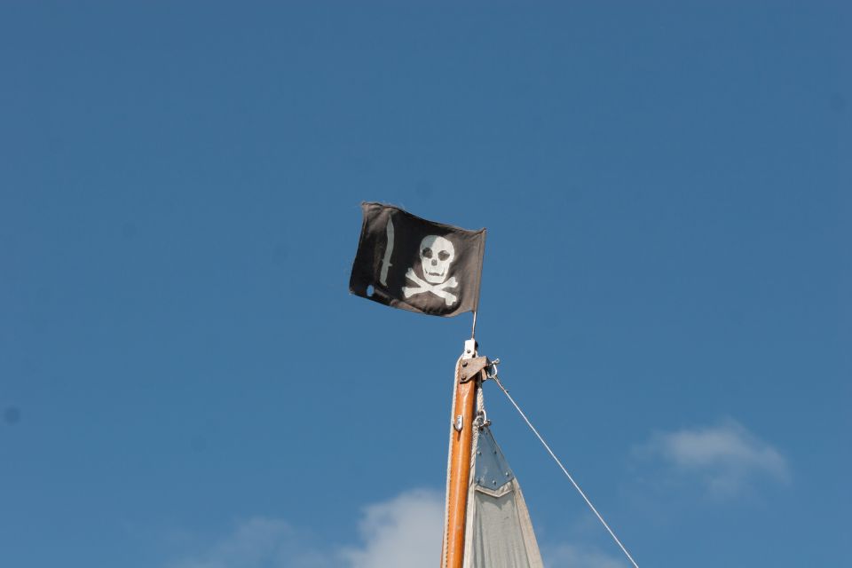 Pirate flag on a sailboat mast.