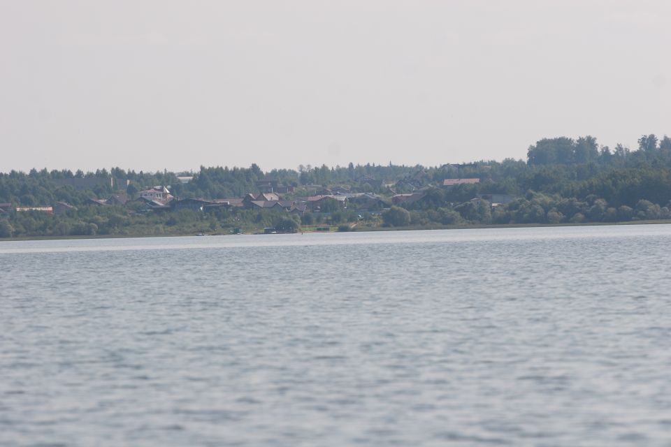 A lake with a village on the far shore.