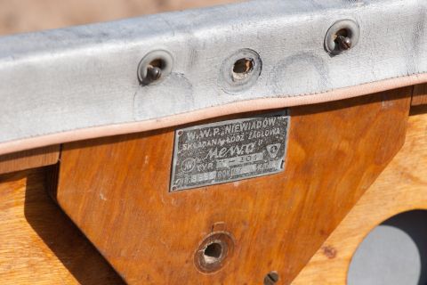 1993 Ford Bronco - A metal plaque is attached to the wooden frame of a boat. The plaque reads "W.W.P. NIEWIADÓW SKŁADANA ŁÓDŹ ŻAGLOWA Mewa" and includes seria…