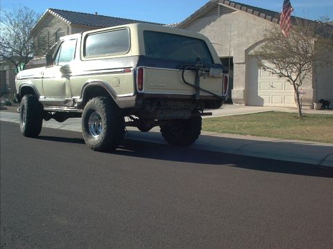 1979 Ford Bronco - Rear view of a lifted 1979 Ford Bronco with large off-road tires.