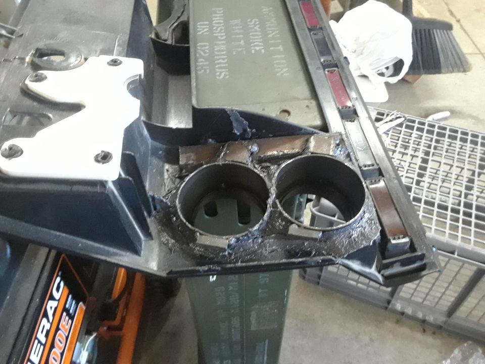 Modified vehicle dashboard with circular openings and white bracket
