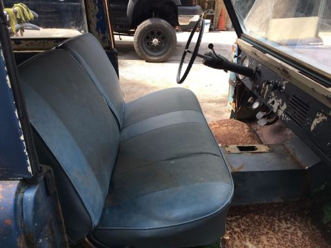 1967 Ford Bronco - Interior view of a vehicle, showing the seats, dashboard, and steering wheel.