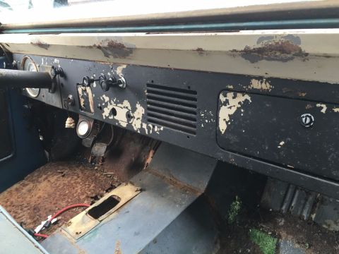 1967 Ford Bronco - Interior view of a 1967 Ford Bronco, showing significant rust and wear on the dashboard and floor.
