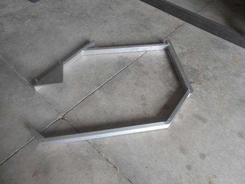 1992 Ford Bronco - A custom-fabricated aluminum frame, possibly for a vehicle project, is laid out on a concrete floor. The frame has a hexagonal shape with a…