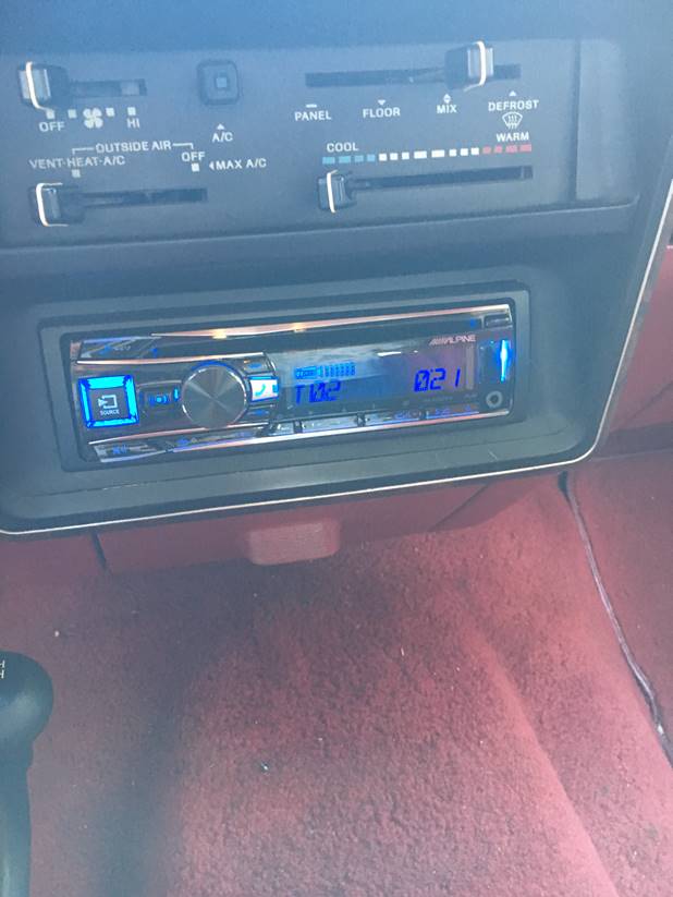 1988 Ford Bronco interior dashboard with climate controls and Alpine stereo.