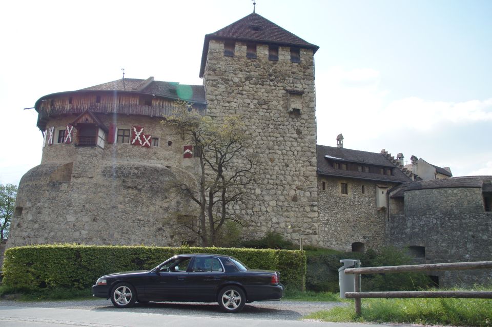 Black 2003 Mercury Marauder parked on a road with a castle in the background