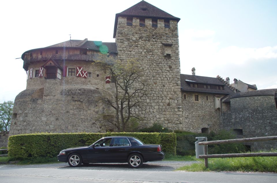 Black 2003 Mercury Marauder parked on a paved area with a castle in the background