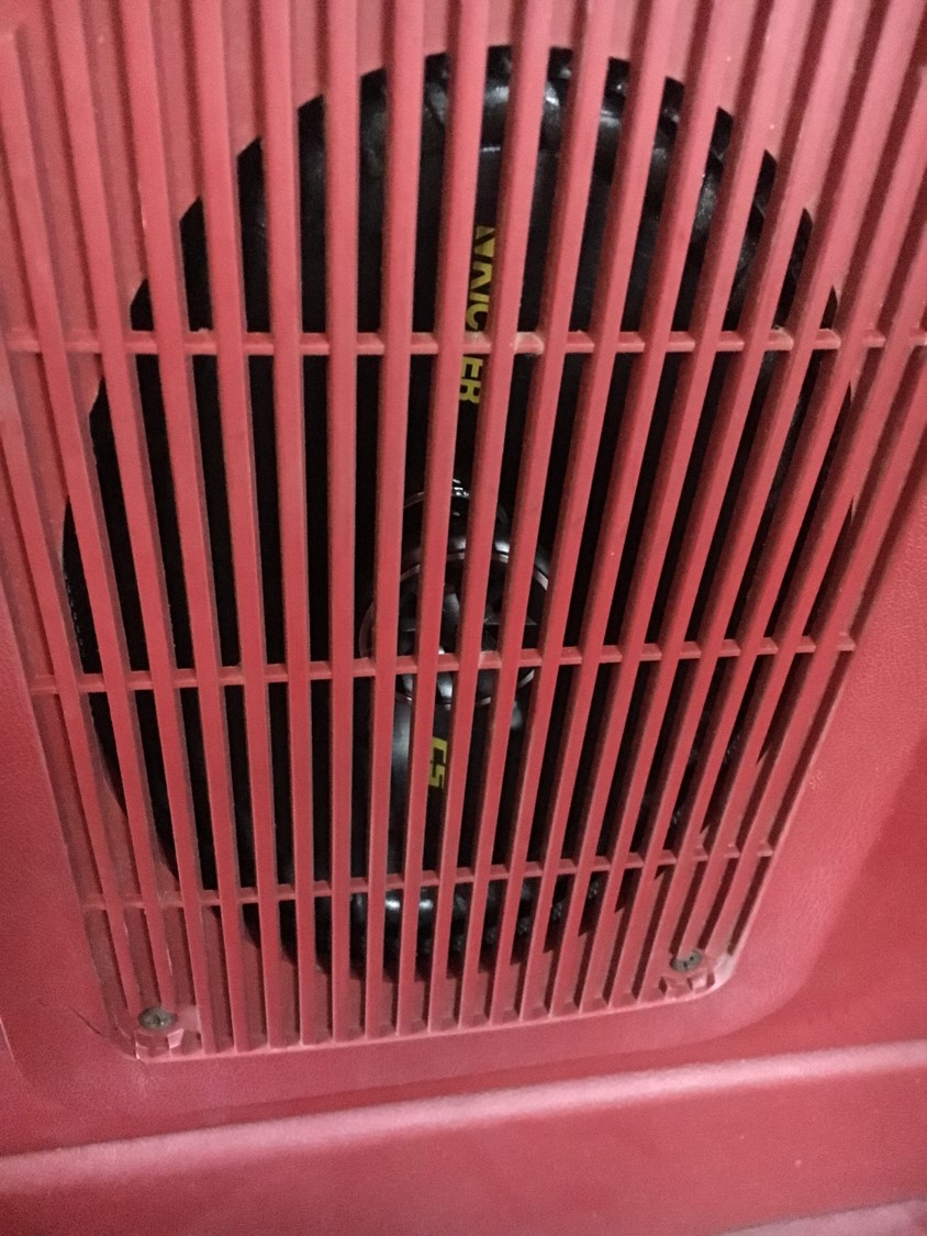 Red speaker grille with black speaker visible behind it. Text 'NAICHER' is visible on the speaker