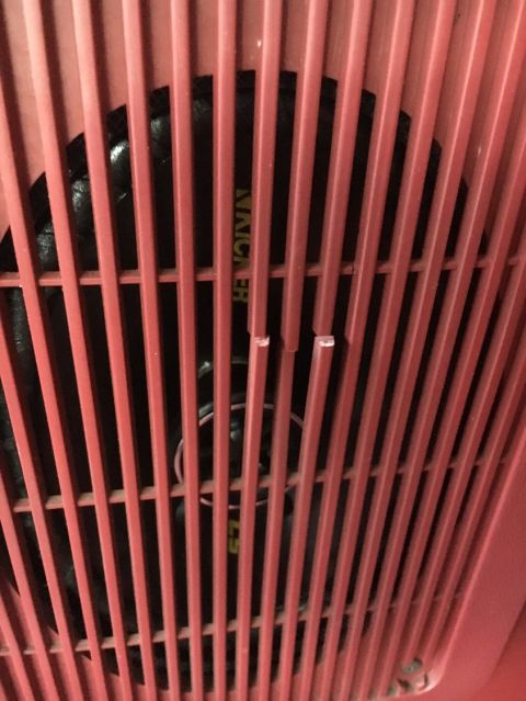 1988 Ford Bronco - Close-up of a red grille covering a black speaker, with visible text and a Supermotors logo.