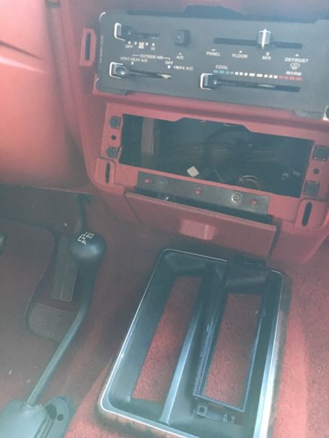 1988 Ford Bronco - Interior view of a 1988 Ford Bronco, climate controls and gear shifter.