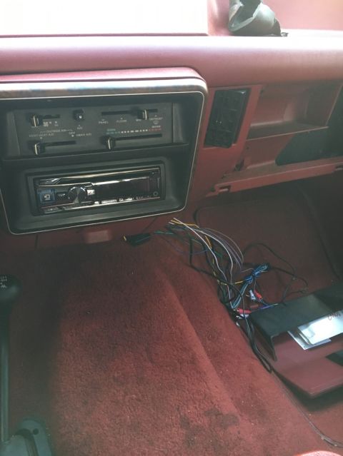 1988 Ford Bronco - The dashboard shows an aftermarket stereo and exposed wiring, indicating recent work or modifications.