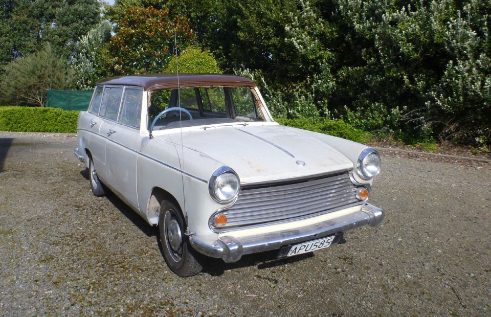 Austin A40 Farina Countryman wagon, white with brown roof, parked outdoors