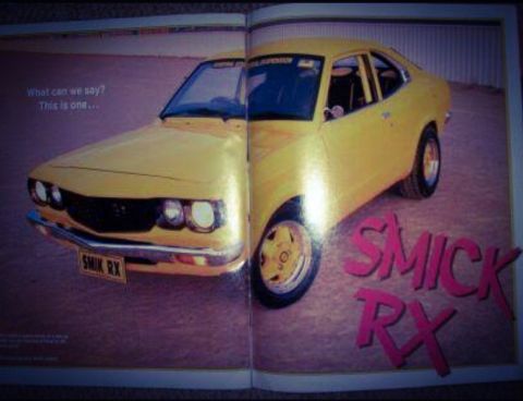 1973 Mazda RX-3 - A yellow 1973 Mazda RX-3 coupe is featured with custom text on the floor, identified as "SMICK RX".