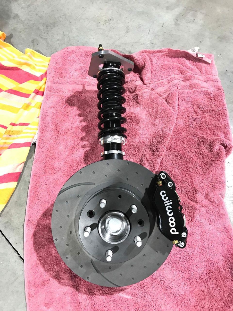 Wilwood brake caliper and rotor assembly on a pink towel