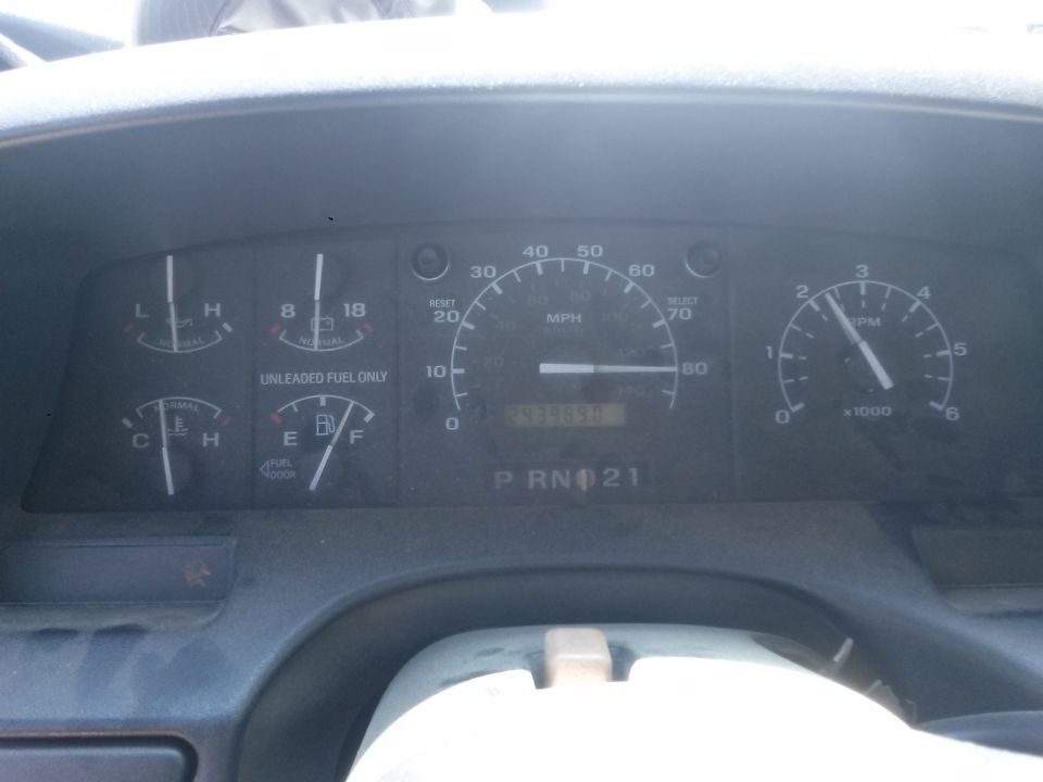 Dashboard gauges with speedometer, tachometer, fuel, and temperature gauges