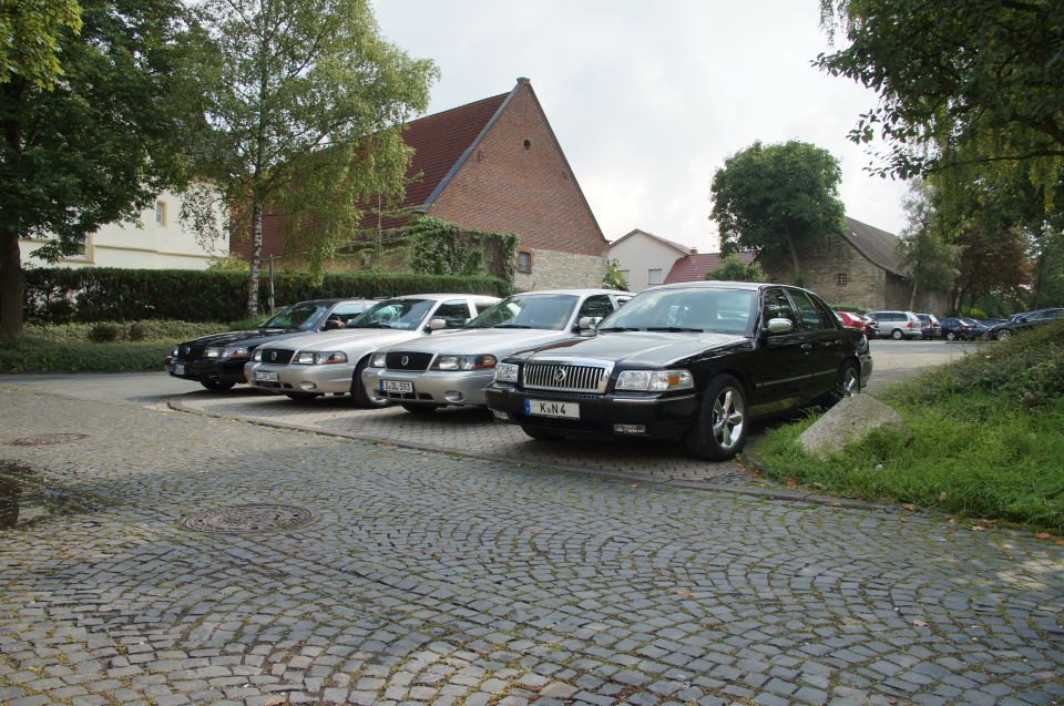 Black 2003 Mercury Marauder parked in front of several silver sedans
