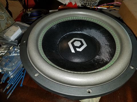 1994 Ford Bronco - A close-up view of a car subwoofer, showing its cone and surround details.