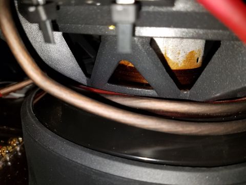 1994 Ford Bronco - Close-up view of a car stereo speaker and its internal components.