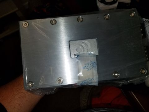1994 Ford Bronco - Car amplifier with silica gel packet on top, likely for protection during shipping.