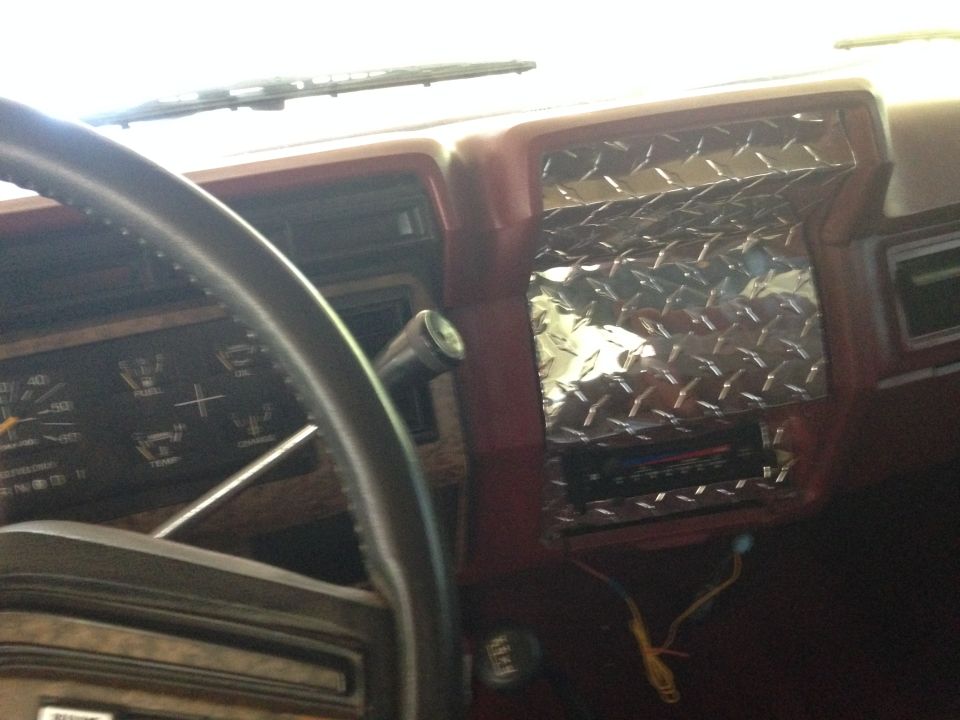 1986 Ford Bronco interior dashboard with diamond plate accent and gauges