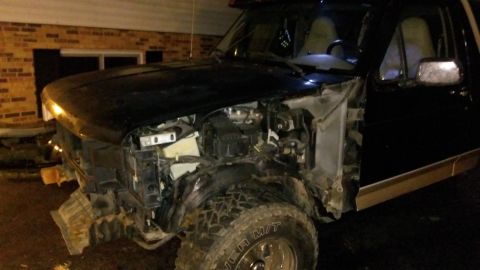 1996 Ford Bronco - Front end of a 1996 Ford Bronco showing significant damage to the grille and fender areas.