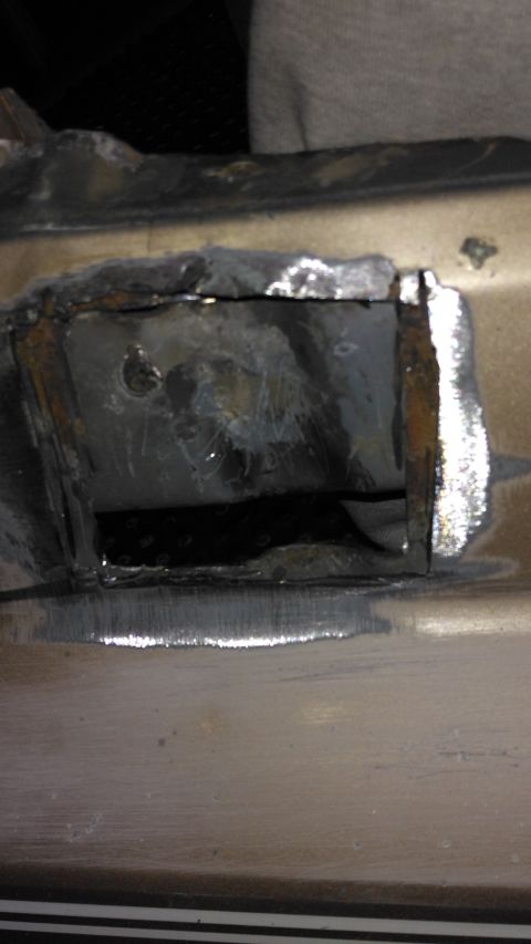 1996 Ford Bronco - This photo shows a section of a vehicle's frame that has been cut and welded, indicating repair work.