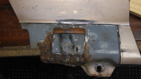 1996 Ford Bronco - This part of a vehicle shows significant rust and damage, indicating repair work is needed.