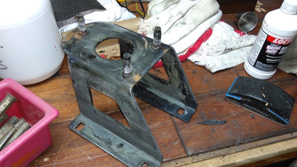 Here I start working on the tire carrier. There was no major rust, but I wanted to repaint it anyways. Most pieces didn't get stripped to bare metal; just sanded, primed, and painted with spray bed liner.