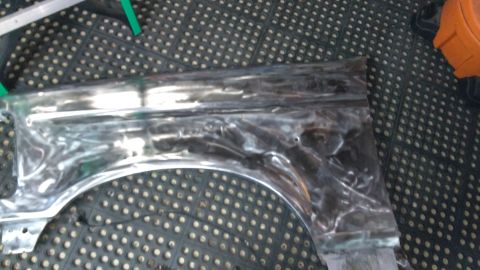1996 Ford Bronco - Driver-side fender down to bare metal.