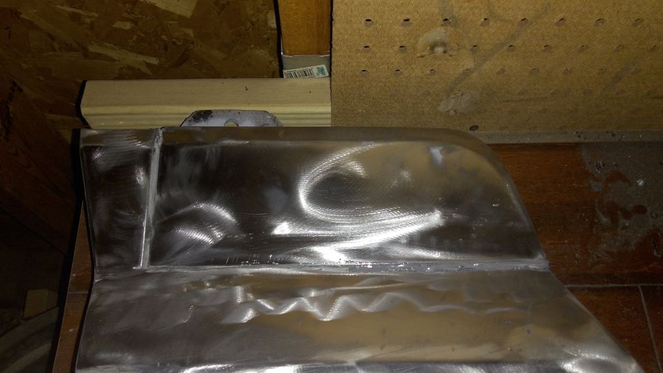 New fender panel placed on with panel adhesive. A friend helped me weld it later on.