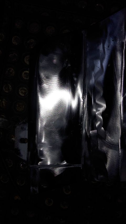 1996 Ford Bronco - A close-up view of a shiny metal surface with distinct circular patterns and reflections.