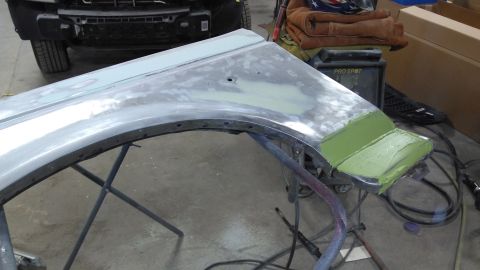 1996 Ford Bronco - Fender undergoing bodywork and repair in a workshop setting.
