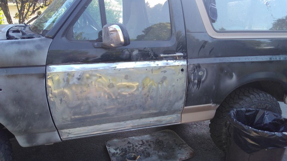 Finally starting to strip paint on the rest of the truck. You can see part of the fender in this picture. It stayed in that primer-glide coat state for months. Got some weird looks.