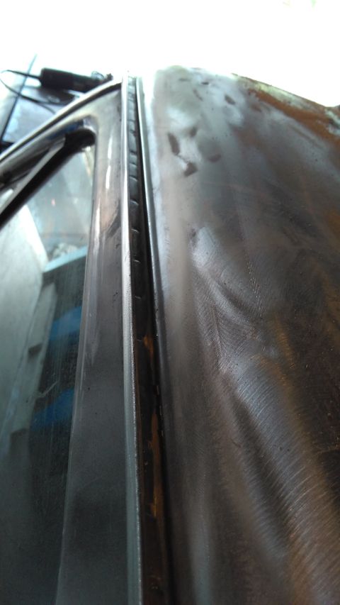 1996 Ford Bronco - Rain gutters needed to be cleaned out of old seam sealer. An electric wire brush worked well.