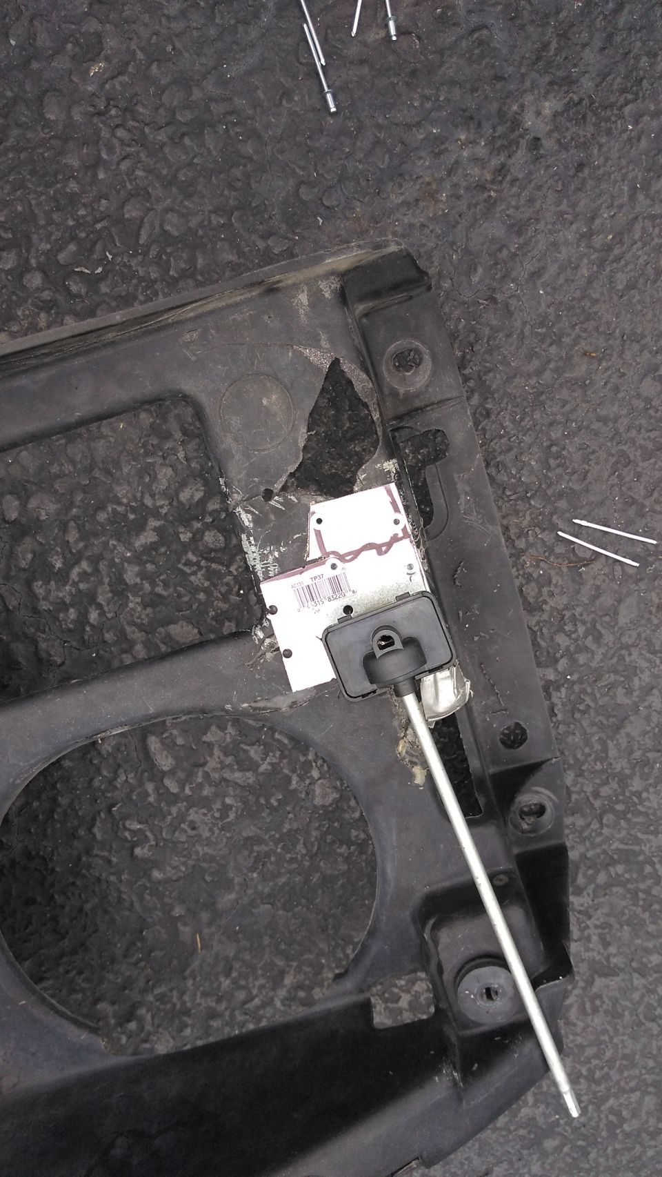The plastic header panel was very broken around the headlights. I fabbed up some sheet metal and riveted it on to give structure and a place to attach the headlights (without duct tape!!!).