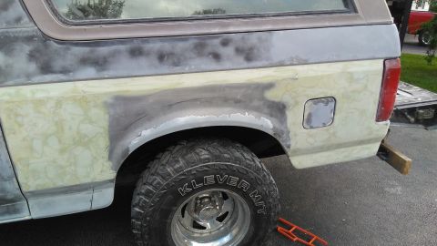 1996 Ford Bronco - Ford Bronco bodywork in progress, primer and filler applied to rear quarter panel.
