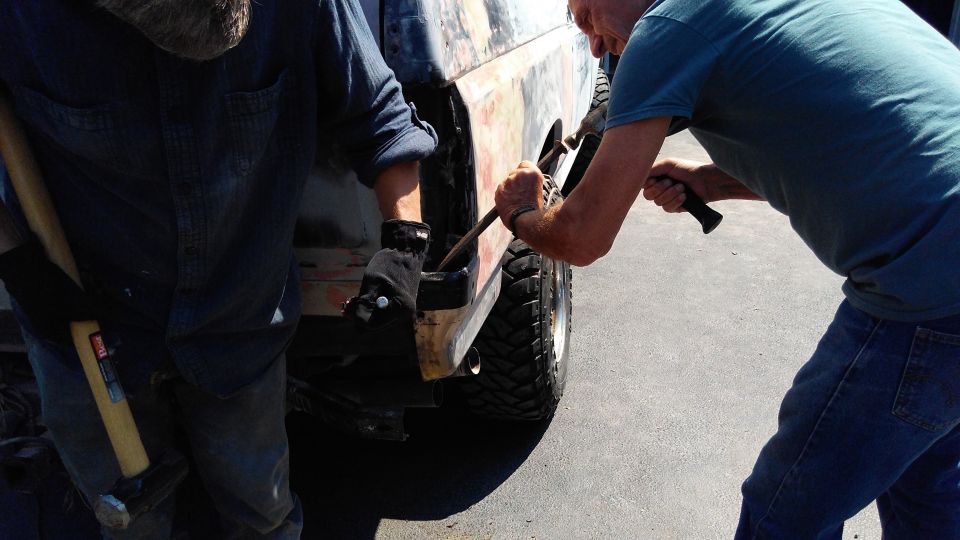 Grandpa and dad helped to remove a couple broken bolts reminiscent of the tire carrier. We ended up drilling them out and welding nuts on the inside to put the bolts through.