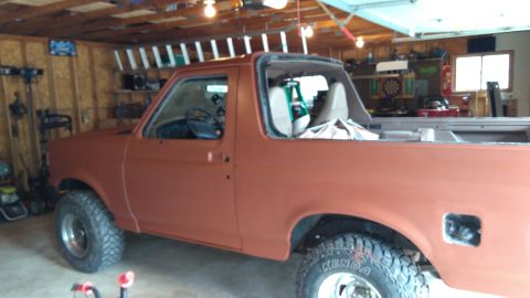 1996 Ford Bronco - This 1996 Ford Bronco is shown in a garage, appearing to be in the process of being repainted.