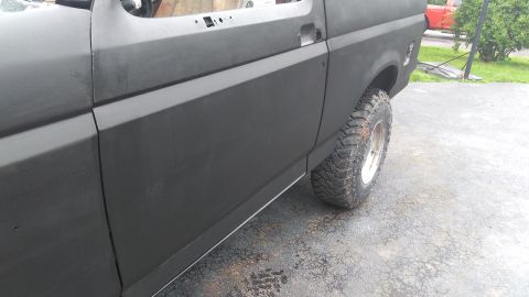 1996 Ford Bronco - Side view of a 1996 Ford Bronco in primer, ready for paintwork.