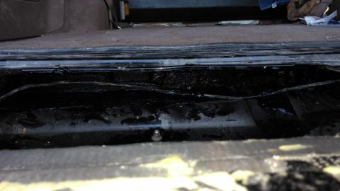 1996 Ford Bronco - Not a great picture, but I drenched the bottom of the interior tailgate in undercoating. Not gonna rust anymore, and don't be worried I lef…