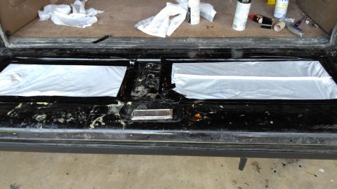 1996 Ford Bronco - I covered the glass access with a bunch of garbage bags and duct tape to stop water leaking out.