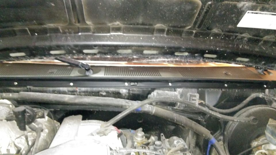 Windshield cowl installed, along with new weatherstripping between the cowl and hood.