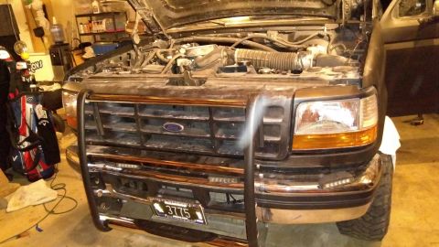 1996 Ford Bronco - Front end all pot together. With those plastic header repairs I finally bought new headlights.