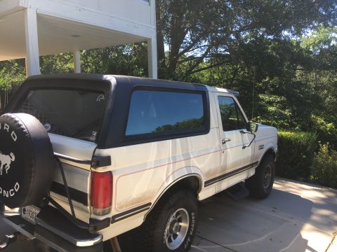 1988 Ford Bronco - This 1988 Ford Bronco is shown in a 3/4 front view, its iconic spare tire cover.