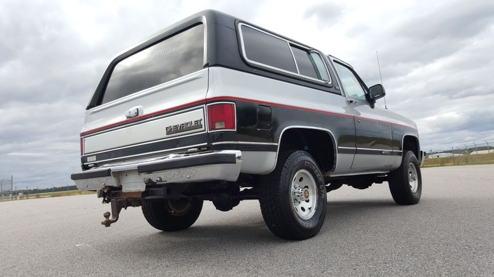 1981 Chevrolet K5 Blazer rear view, two-tone silver and black paint with red stripe