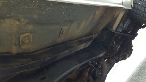 1995 Ford Bronco - Underside view of a vehicle's chassis, showing suspension components and a tire. The registry claims it is a 1995 Ford Bronco, but this vie…