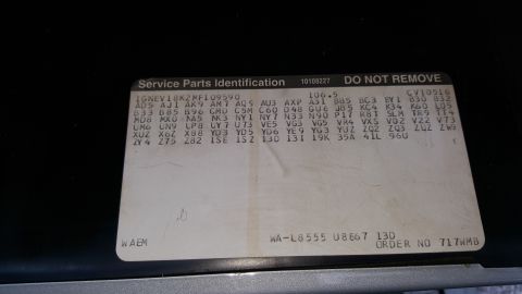 1995 Ford Bronco - This sticker contains various codes and numbers related to vehicle parts and identification.