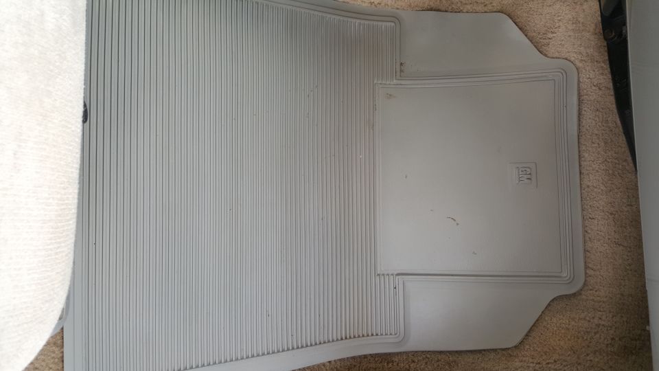 Gray floor mat with GM logo