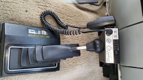 1995 Ford Bronco - Interior view of vehicle controls including shifter, CB radio, and transfer case selector.