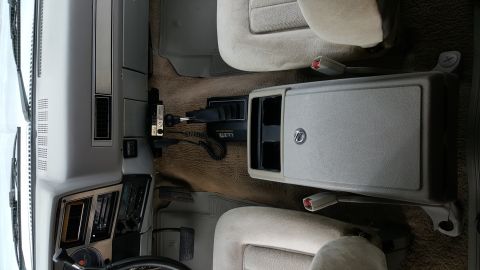1995 Ford Bronco - Interior view of a vehicle's front cabin, including seats and dashboard elements.